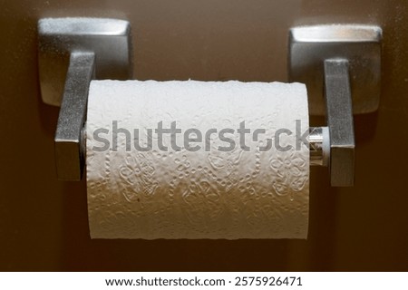 Similar – Foto Bild Ersatzrolle Toilettenpapier an der Wand hängend in einer öffentlichen Toilette