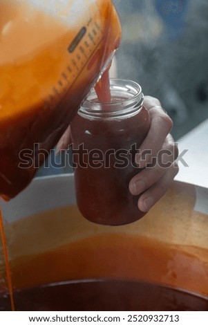 Similar – Image, Stock Photo Homemade jam being poured in a jar