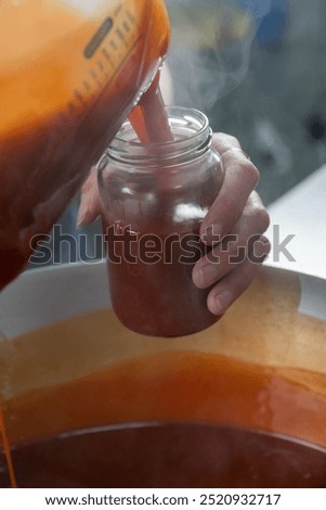 Similar – Image, Stock Photo Homemade jam being poured in a jar