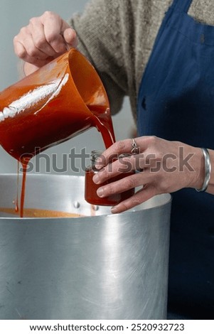 Similar – Image, Stock Photo Homemade jam being poured in a jar