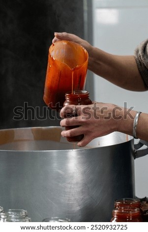 Similar – Image, Stock Photo Homemade jam being poured in a jar