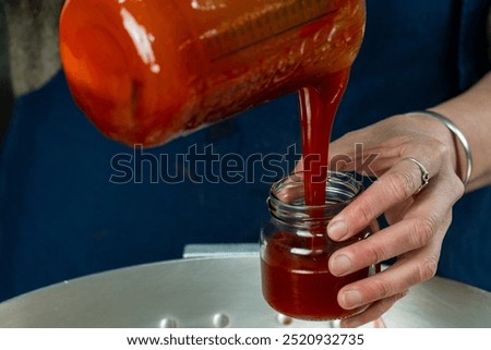 Similar – Image, Stock Photo Homemade jam being poured in a jar