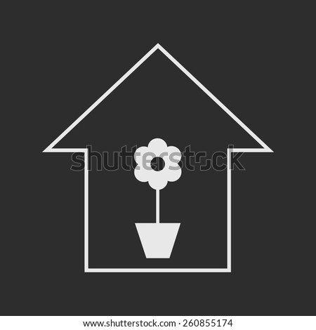 Simple white house with flower in a pot on dark grey background. House plants