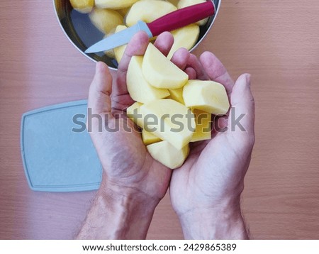 Similar – Image, Stock Photo Unrecognizable chef peeling potato in kitchen