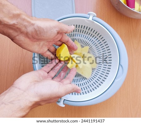 Similar – Image, Stock Photo Unrecognizable chef peeling potato in kitchen