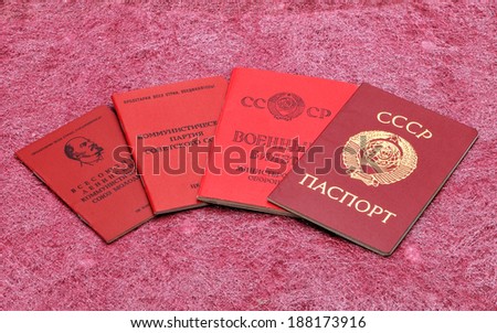Old Soviet documents on a red background.