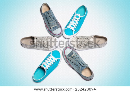 Sports gym shoes stand around on a light background.