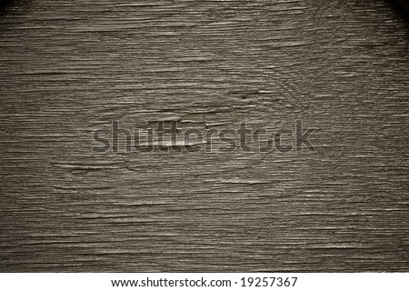 Very cracked layered wood texture in neutral monochrome, with deep shadows and clear highlights, excellent contrast.