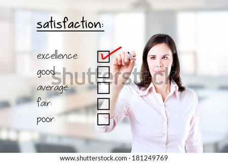 Young business woman checking excellence on customer satisfaction survey form. Office background.