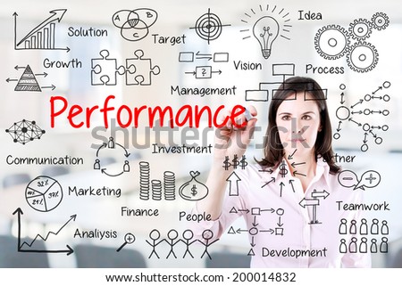 Young businesswoman writing performance business scheme. Office background.