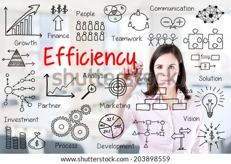 Young business woman writing concept of efficiency business process. Office background.