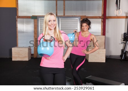 Woman holding a kettle-bell