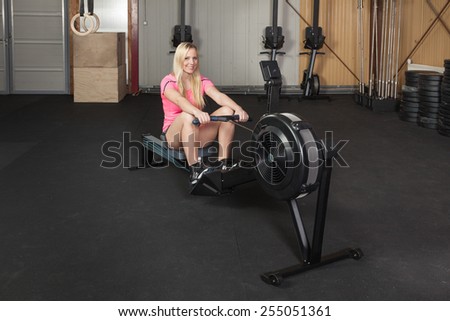 Woman on a rowing machine - fitness