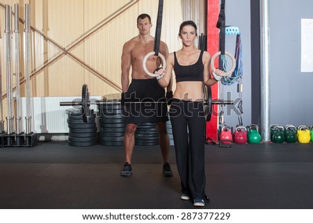 fitness training woman using gymnastics rings