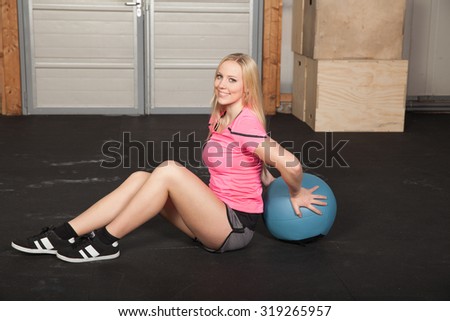 Woman aerobic training with medicine ball
