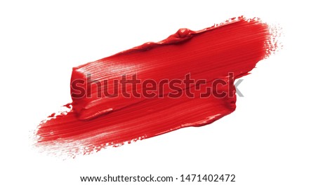 Lipstick smear smudge swatch isolated on white background. Cream makeup texture. Bright red color cosmetic product brush stroke swipe sample Foto d'archivio © 