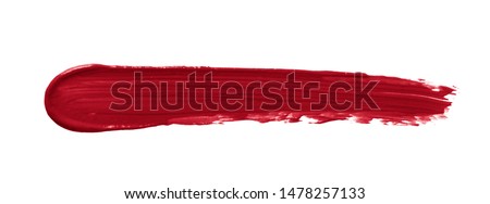 Lipstick smear smudge swatch isolated on white background. Creamy makeup texture. Red color cosmetic product brush stroke swipe sample Foto d'archivio © 