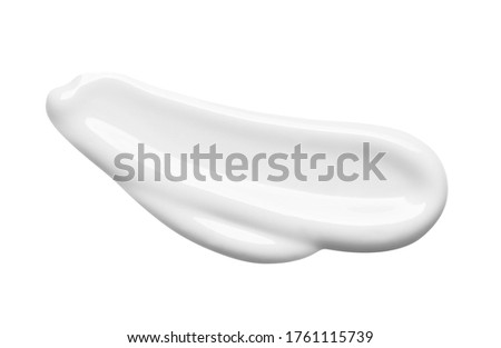 White lotion swatch isolated on white. Cosmetic liquid cream texture. Skin care product macro.