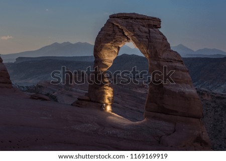 Similar – Image, Stock Photo Unrecognizable traveler with flashlight exploring foggy forest