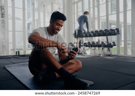 Image, Stock Photo Disabled athlete using phone