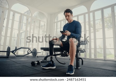 Similar – Image, Stock Photo Disabled athlete using phone