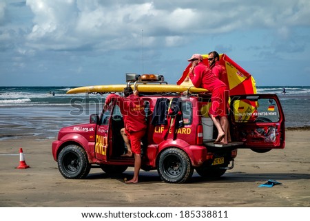 DEVON, CORNWALL/UK - AUGUST 17 : RNLI Lifeguards on duty at Bude Cornwall on AUGUST 17, 2014. Unidentified people.