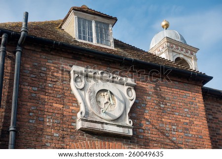 RYE, EAST SUSSEX/UK - MARCH 11 : Old sundial on a building in Rye East Sussex on March 11, 2015