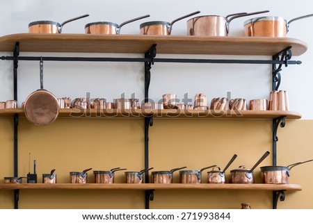 CARDIFF/UK - APRIL 19 : Shelves Full with Copper Saucepans in the Castle Kitchen at St Fagans National History Museum in Cardiff on April 19, 2015