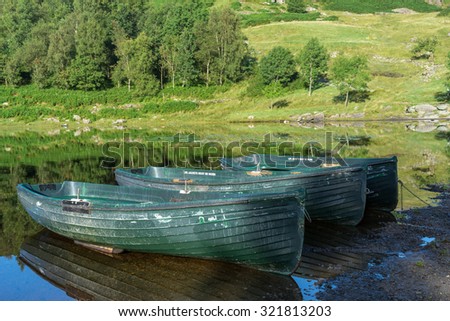 WATENDLATH, LAKE DISTRICT/ENGLAND - AUGUST 31 : Rowing boats moored at Watendlath Tarn in the Lake District England on August 31, 2015