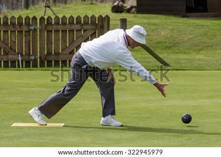 ISLE OF THORNS, SUSSEX/UK - SEPTEMBER 3 : Lawn bowls match at Isle of Thorns Chelwood Gate in Sussex on September 3, 2015. Unidentified man
