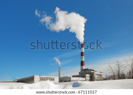 factory, smoke and blue sky in the winter morning