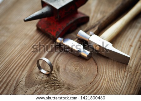 Similar – Image, Stock Photo Jeweler with hammer and chisel creating jewelry in workshop