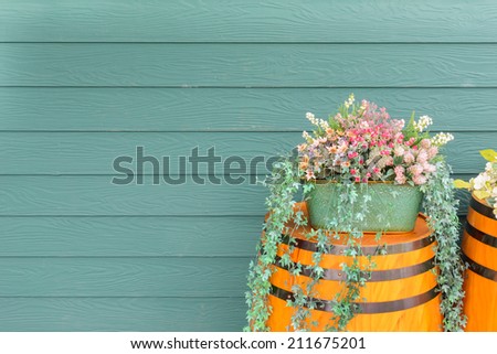 old wooden barrel with beautiful flowers