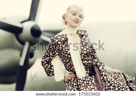 Vintage stylized photo of beauty girl and plane on background
