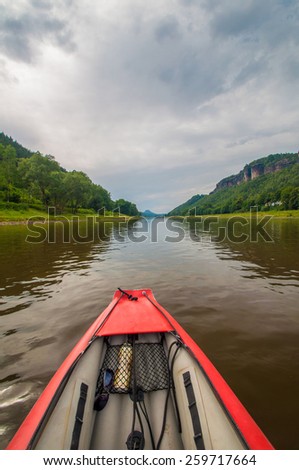 View from the rubber boat on the summer river in the deep canyon