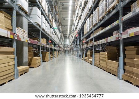 Rows of shelves with boxes. Interior of warehouse.