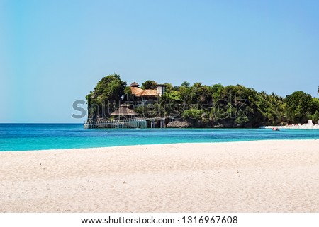 Beach paradise at Puerto Galera is municipality in province of Oriental Mindoro Philippines. Holiday and vacation concept. Blue sky, palm trees and clear water. Sunny summer day. Landscape sandy beach Zdjęcia stock © 