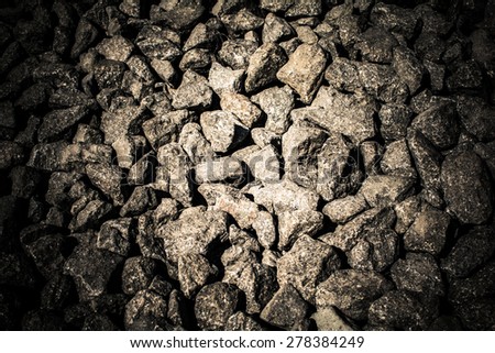 Small gray stones are evenly creating a solid background.