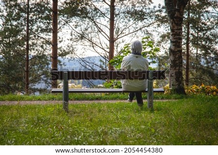 Similar – Image, Stock Photo Senior woman sitting alone on the sofa at home