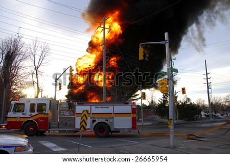 ONTARIO, CANADA – MARCH 13 : Firemen try to put off fires at a hydro substation in Shefford Road in Ottawa, Ontario, Canada on March 13, 2009. The fire leaves 4,400 without power for several hours.