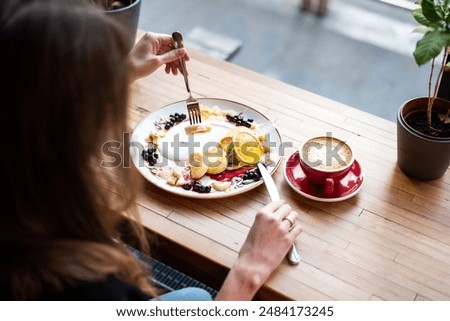 Similar – Foto Bild Crop-Frau isst leckeres Müsli zum Frühstück zu Hause