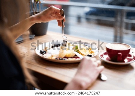 Similar – Foto Bild Crop-Frau isst leckeres Müsli zum Frühstück zu Hause