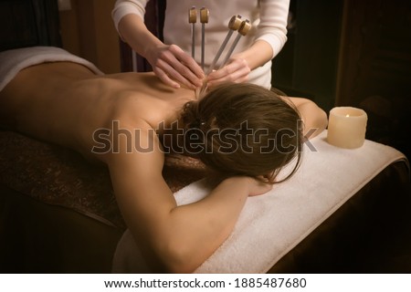 woman getting treatment. Acutonic relax massage and sound healing. Tuning forks Photo stock © 