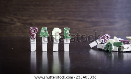 Common business terms - Slightly defocused and close-up of RACE word on clothes peg stick with lots of clothes peg at background