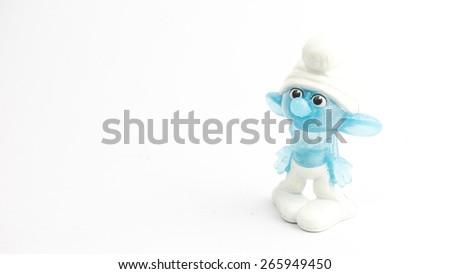 Kuala Lumpur, Malaysia - April 02, 2015: Cute Smurf toy figure on plain background. The Smurfs is a Belgian comic and tv franchise centered on a fictional colony of small blue creatures in the forest
