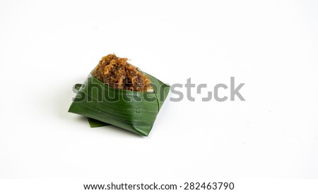 Steam Glutinous Rice with Brown Sugar or locally known in Malaysia as Pulut Pagi. Traditional well-known pastry from Kelantan. Concept of asian local delicacy. Isolated on white background. Copy space
