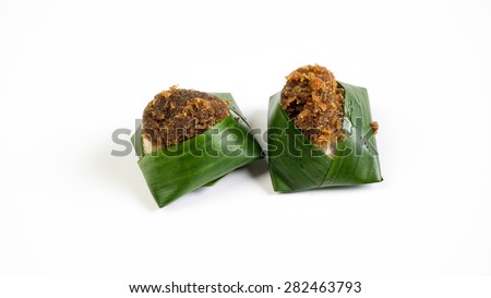 Steam Glutinous Rice with Brown Sugar or locally known in Malaysia as Pulut Pagi. Traditional well-known pastry from Kelantan. Concept of asian local delicacy. Isolated on white background. Copy space