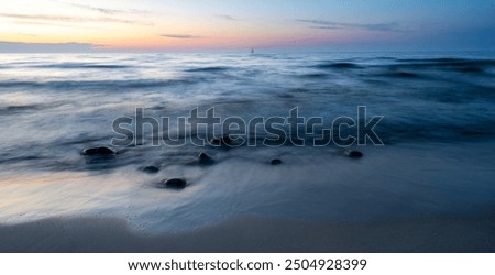 Similar – Image, Stock Photo sunset over the baltic sea, portrait of a young woman standing on the beach