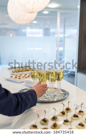 Glasses of sparkling champagne on a buffet table