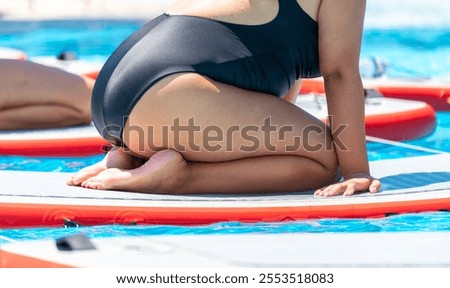 Similar – Image, Stock Photo Woman practicing on paddleboard in sea